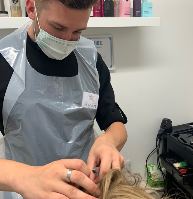 Hair to Ware hair loss consultant in PPE during consultation